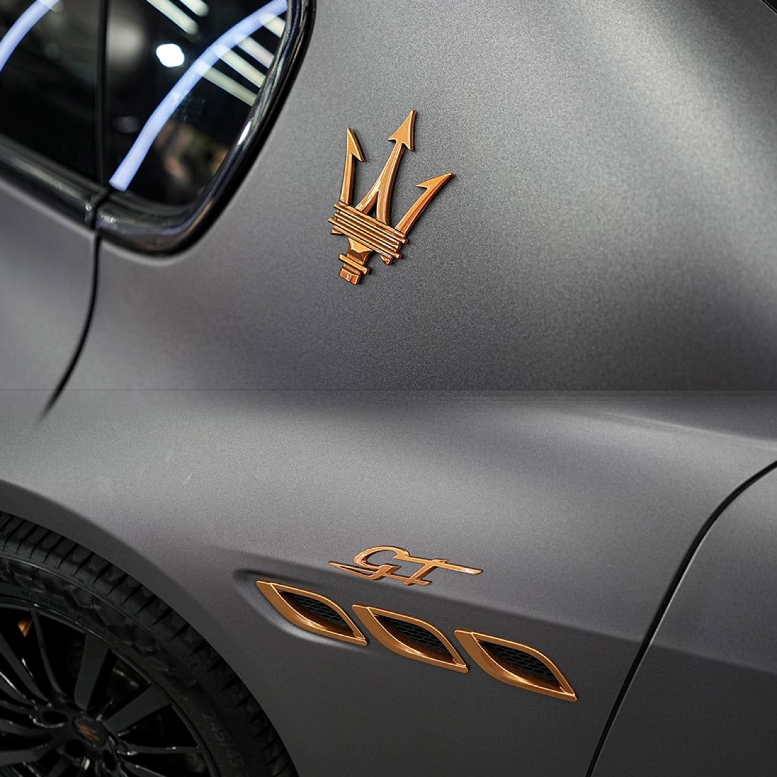 Disassembled panel edge tucking on luxury vehicle wrap